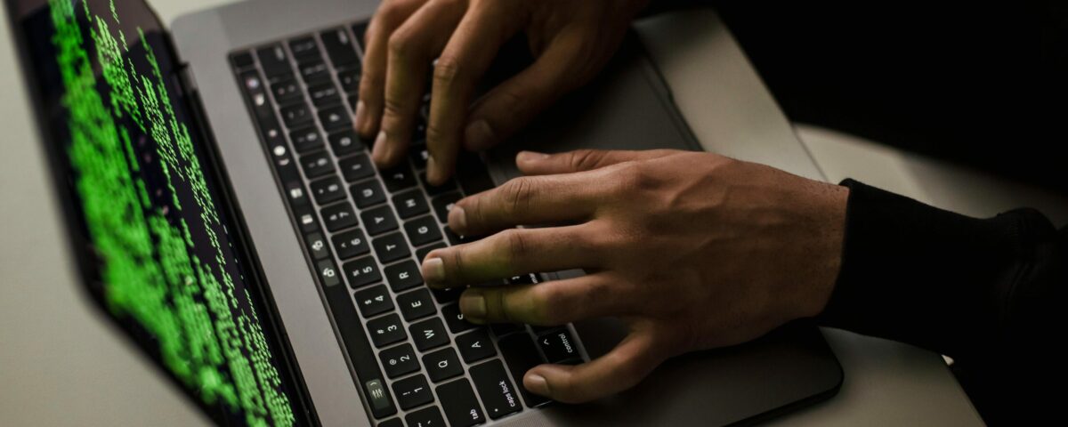 crop-cyber-spy-hacking-system-while-typing-on-laptop