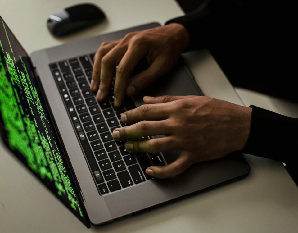 crop-cyber-spy-hacking-system-while-typing-on-laptop