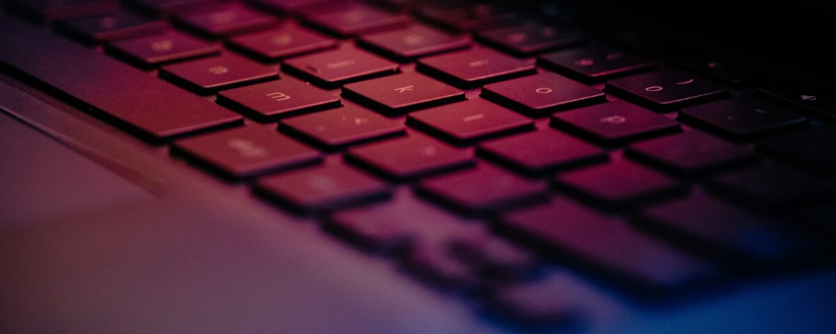 a-close-up-of-a-keyboard-with-a-blurry-background