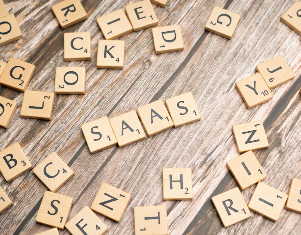 scrabble-letters-spelling-saas-on-a-wooden-tabl