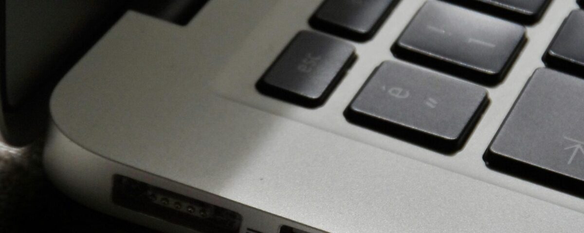 Free Detailed view of a silver laptop showing keyboard and multiple ports. Stock Photo