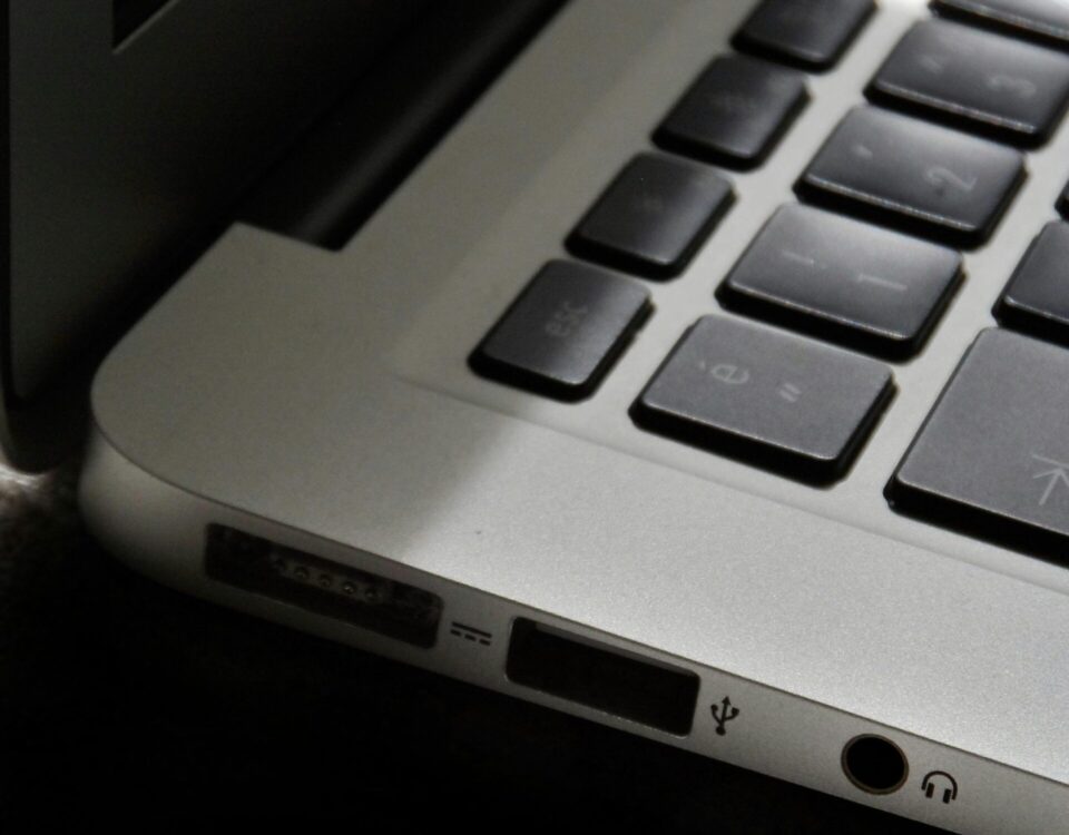 Free Detailed view of a silver laptop showing keyboard and multiple ports. Stock Photo